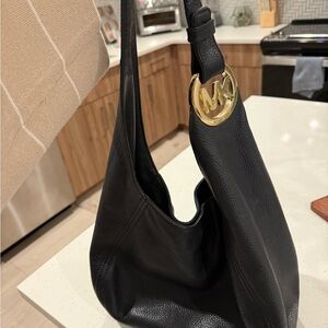 Michael Kors Black Hobo Bag with Gold Accents